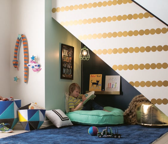 Unused space underneath the basement stairs is a fort space for kids and one of the best basement design ideas for 2023