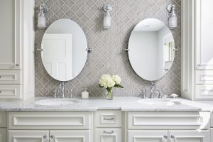 An arabesque tile gives this vanity backsplash a unique and timeless look.