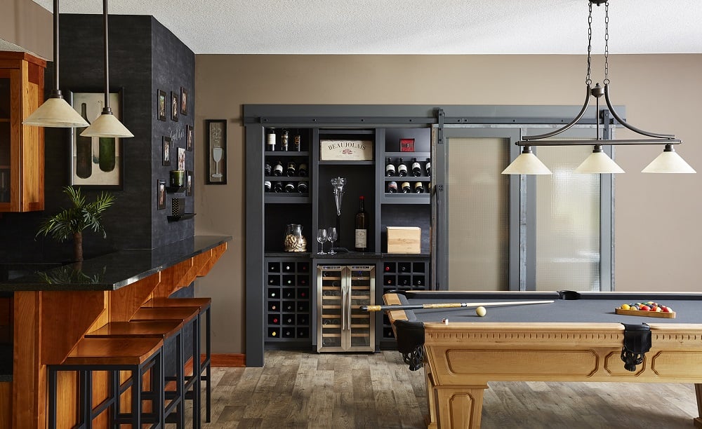 Industrial Barn Door to Open Wine Cellar