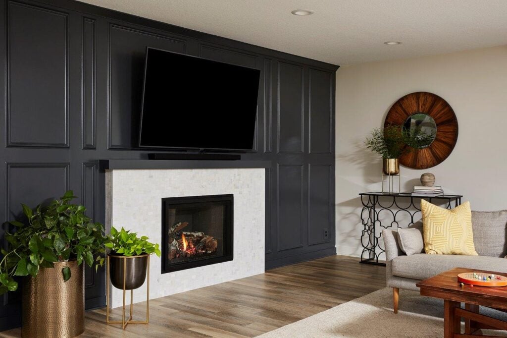 Sherwin WIlliams Iron Ore on a gleaming marble mosaic fireplace creates a modern aesthetic in this living room that is hard to beat. (Interior Design by Carla Bast | Carla Bast Design)