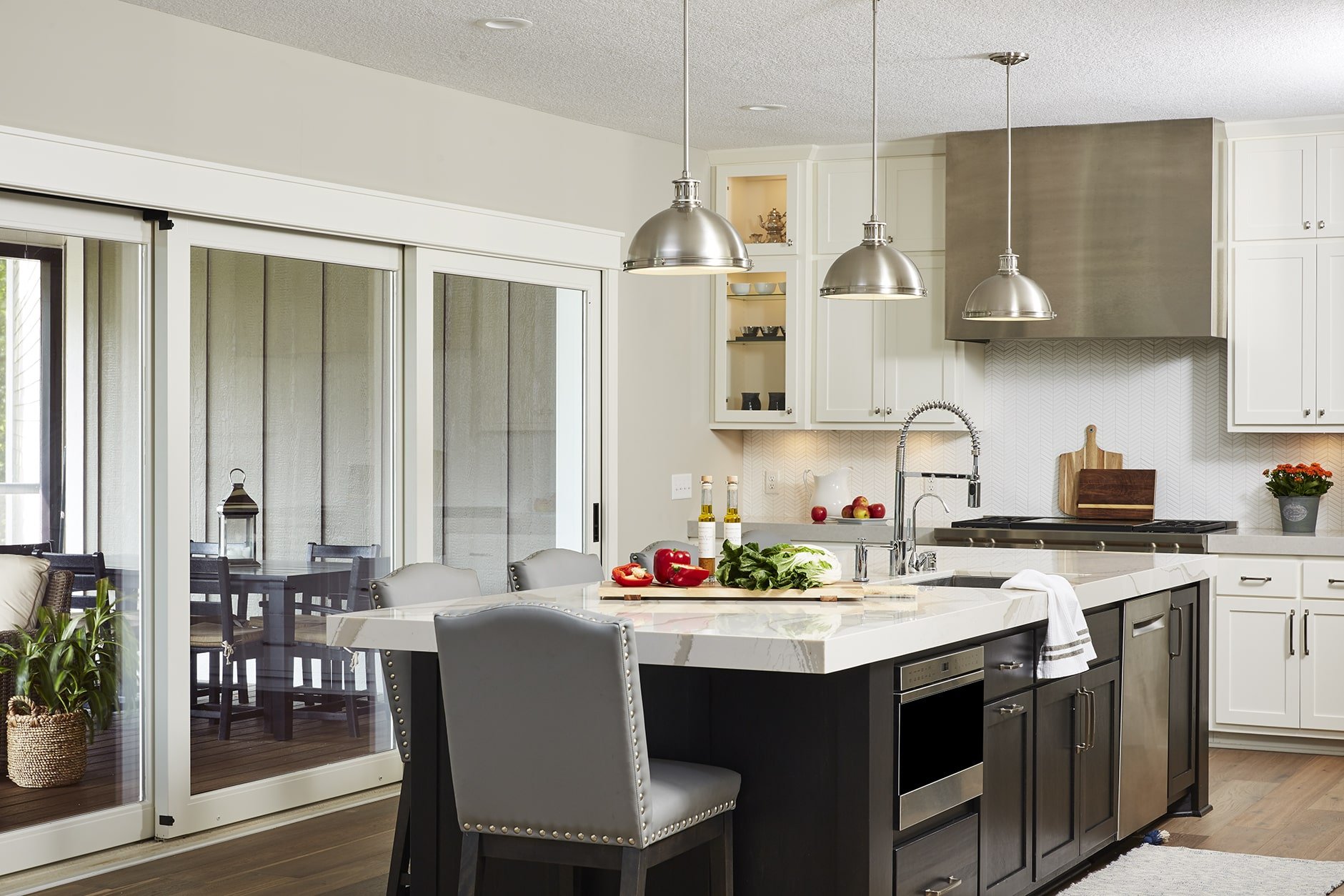 The best countertops for your lifestyle. Spacious white kitchen with Cambria quartz countertops.
