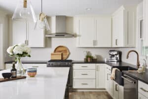 Quartz kitchen countertops on kitchen island, leathered granite countertops on perimeter counters