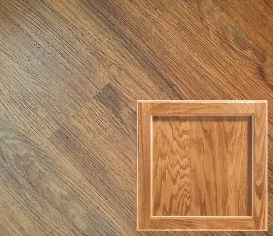 new lvp wood toned floor and honey oak cabinets