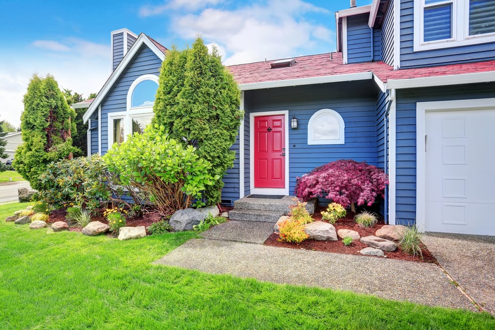 bright blue house with red door 90s decor updates