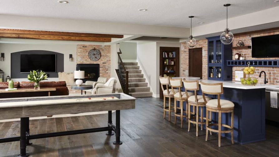 This lower level finish blends function and fun with ample lounge seating, a shuffleboard, and a full bar area.