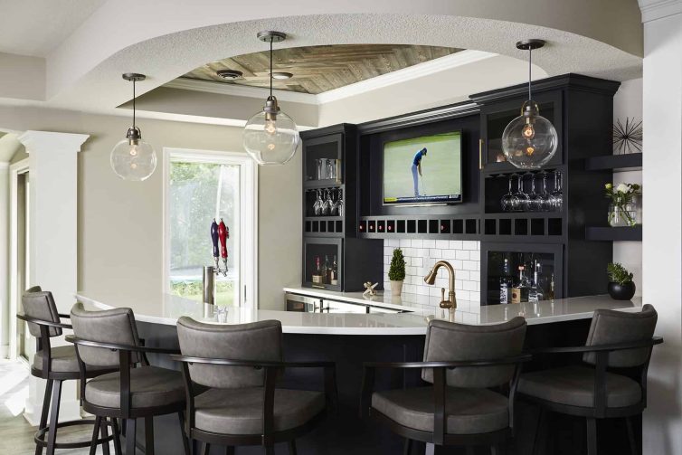 Black Basement Wet Bar with Subway Tile and TV