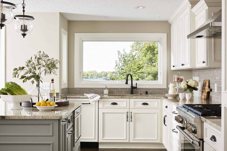 A wide window overlooks the lake from the kitchen sink, giving the owners the perfect view while doing the dishes.
